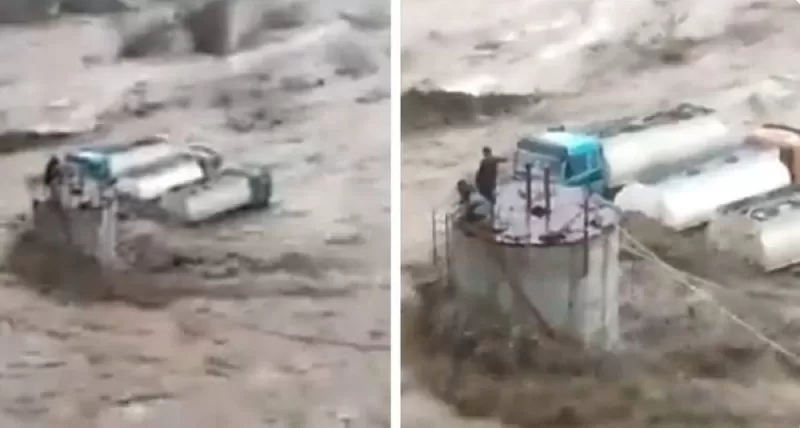 شاهد.. وافدون يلجأون إلى سطح خزان مياه لحماية أنفسهم من الغرق وسط سيول جازان