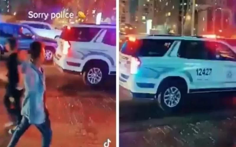 شاهد: وافد آسيوي في الكويت يتحدى زملائه ويقذف سيارة شرطة ببالونة ماء