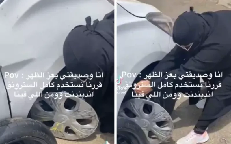 بالفيديو: فتاة سعودية جميلة تشعل المملكة بطريقتها المثيرة في اصلاح كفر سيارتها وسط طريق عام