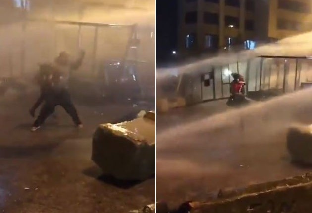 فيديو لمتظاهر لبناني يستخدم طفله درعا بشريا يثير انتقادات واسعة